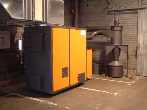 CHAUFFAGE : Générateur d'air chaud alimentation bois pour brûler les copeaux issus de la 